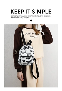 Detailed view of small white canvas backpack featuring elegant black butterfly prints
