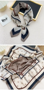 Detail of silk square scarf featuring vintage belt patterns and geometric monogram prints