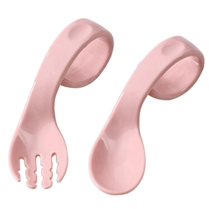 Pink baby training fork and spoon set with ergonomic curved handles on white background