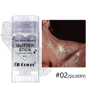 Detailed view of silver glitter stick with model effect on hair and skin