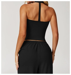 Rear view of black racerback yoga crop top and loose joggers showing back line detail