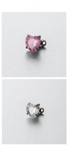 Detail of 6mm heart-shaped zircon piercing stud with four-prong setting in pink and white