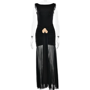 Detail of black sleeveless dress with sheer mesh skirt and gold waist buckle