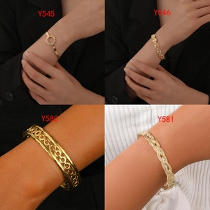 Collage of four gold titanium steel bangles with hollow, woven and cutout geometric designs