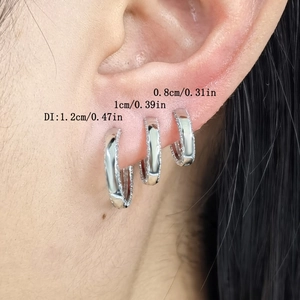 Size comparison of 0.8cm, 1cm, and 1.2cm S925 silver hoop earrings on a real ear model
