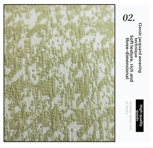 Detailed view of cream-style jacquard woven fabric with soft textured knit pattern