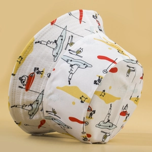 White reversible bucket hat with colorful cartoon illustrations for outdoor sun protection