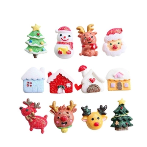 Set of 12 glittering resin Christmas miniatures including Santa, reindeer, and snowmen