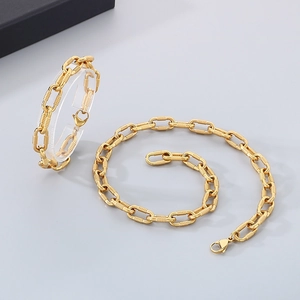 Detailed view of gold stainless steel screw link chain necklace and bracelet jewelry set
