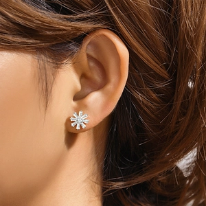 Close-up of S925 sterling silver moon flower stud earring with sparkling cubic zirconia