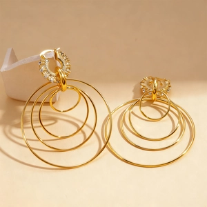 Exaggerated geometric multi-layer gold round hoop earrings with sparkling crystal accents