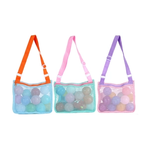Three colorful mesh beach bags for toy storage in orange, pink, and purple designs