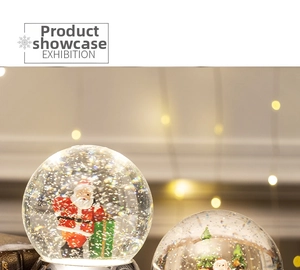 Close-up of festive snow globes with Santa figures and shimmering silver glitter details
