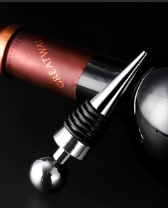 Polished metal wine stopper detail showing six rubber rings for vacuum sealing