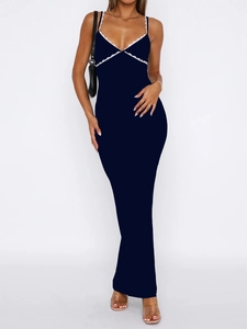 Detail of dark blue V-neck maxi dress featuring white lace trim and sleek sleeveless design