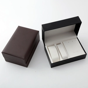 Detailed view of open and closed leather texture watch and jewelry gift boxes