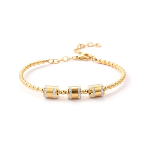 Close-up of gold beaded bracelet with zircon-encrusted charms and lobster clasp detail