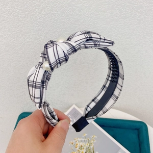 Houndstooth wide headband with knot design and pearl accents for women