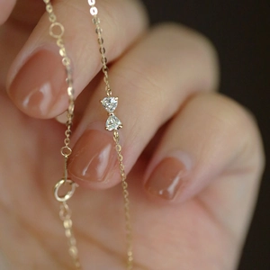 Macro shot of S925 sterling silver bow bracelet with sparkling heart-shaped zircon stones