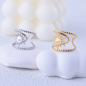 Detailed shot of gold and silver sunburst beaded double-layered stainless steel rings
