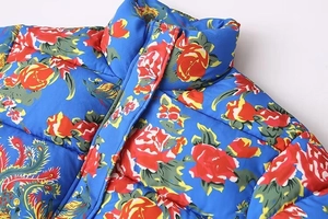 Detailed view of the vibrant blue floral cotton jacket collar with red rose patterns