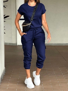 Detail of dark blue casual short sleeve jumpsuit with drawstring waist and cargo pockets