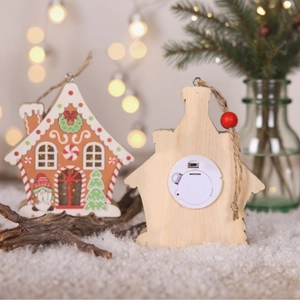 Front and back detail of a glowing wooden gingerbread house Christmas tree ornament
