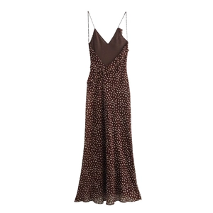 Brown polka dot sleeveless maxi dress with spaghetti straps and open back design