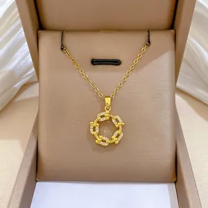 Elegant gold titanium steel necklace with a rotating pavé zircon ring pendant on silk