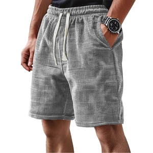 Men's grey waffle knit casual shorts featuring a drawstring elastic waist and side pockets