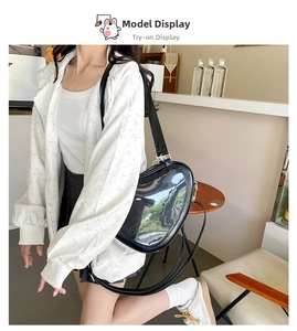 Black heart-shaped JK Lolita ita bag featuring a clear PVC window and adjustable strap