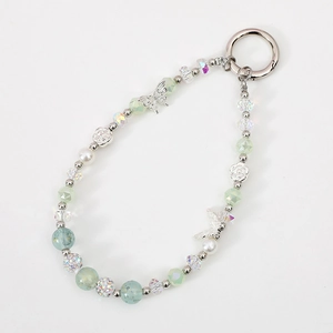 Beaded phone charm with silver butterfly, rose metal charms and crystal beads on white background