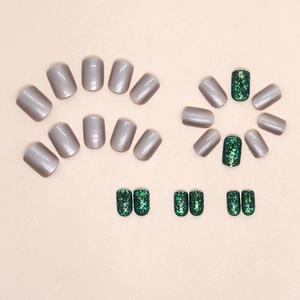 Short square emerald green glitter press-on nails with Aurora shimmer and pearl finish