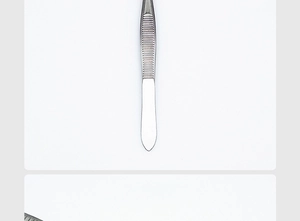 Macro detail of stainless steel lash tweezer with textured handle for precision grip