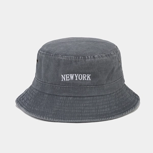Detailed embroidery of NEW YORK text on a charcoal grey washed cotton bucket hat
