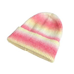 Rainbow tie-dye gradient knit beanie for women made of warm thick pink and yellow yarn