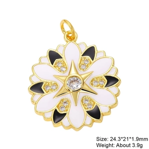 Detail view of gold flower pendant with black and white enamel and cubic zirconia