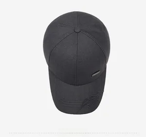 Top view of dark gray cotton baseball cap with mountain embroidery and metal fashion tag