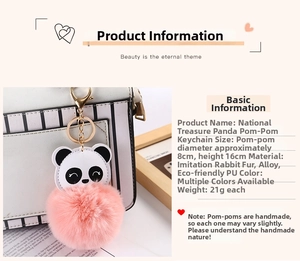 Close-up of fluffy pink faux fur panda keychain with gold alloy lobster clasp on a bag