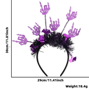 Halloween headband with purple glitter skeleton hands and black feathers on white background