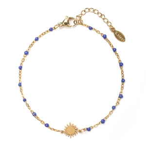 Detail of gold stainless steel bracelet with blue enamel beads and sun charm pendant