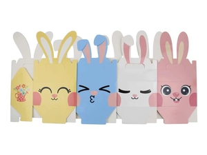 Flat lay of colorful Easter bunny gift boxes with pop-up ears and cute cartoon faces