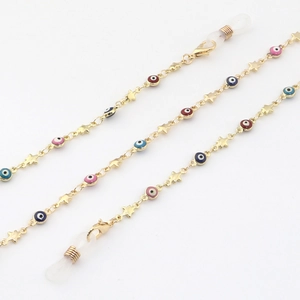 Detail of gold metal glasses chain with colorful evil eyes and star charms