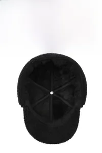 Close-up of the plush faux fur lining and reinforced interior structure of winter earflap hat