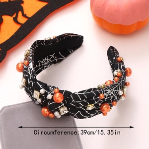 Detail of Halloween headband with spider web pattern, pearls, and rhinestones