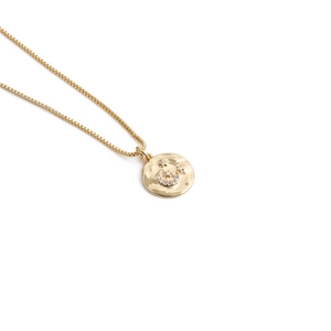 Gold celestial necklace featuring moon and star pendants with sparkling crystals on a chain