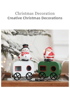 Detail showing vintage iron Christmas train hangers with Santa and Snowman figurines