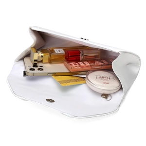 Interior view of white satin evening clutch showing capacity for cosmetics and phone