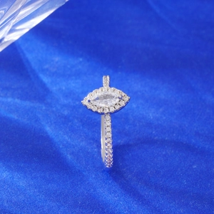 Luxury oversized teardrop cubic zirconia ring on deep blue silk background with side stones