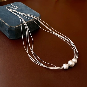 Silver multi-layer snake chain necklace with matte brushed round beads and luxury finish